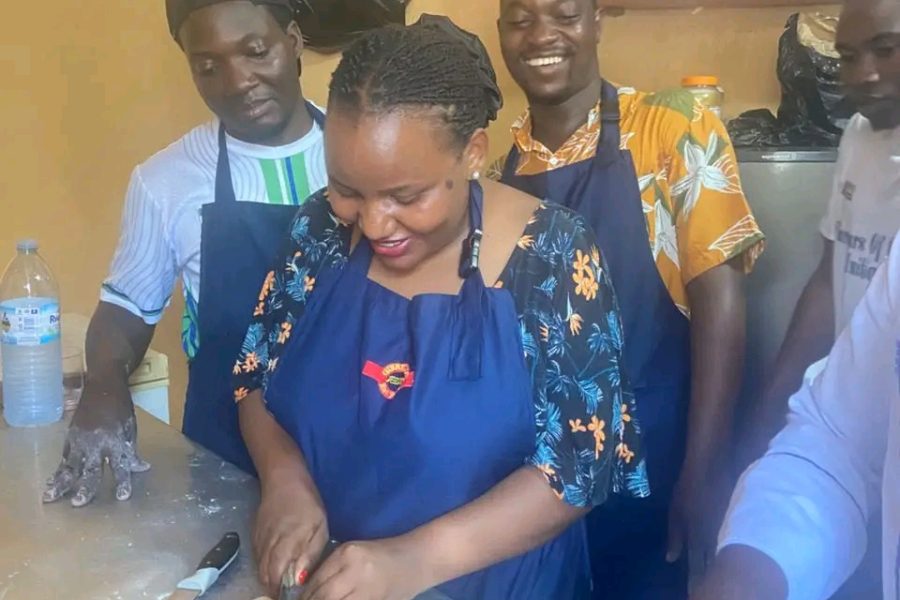 A She Means Business participant preparing vegetables during a practical food skills training session