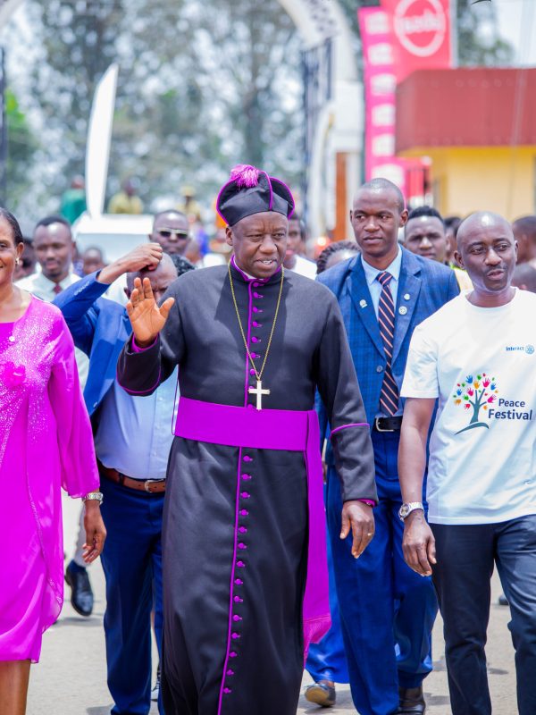 The Bishop arriving at the PPG Annual Peace Festival with organisers and guests
