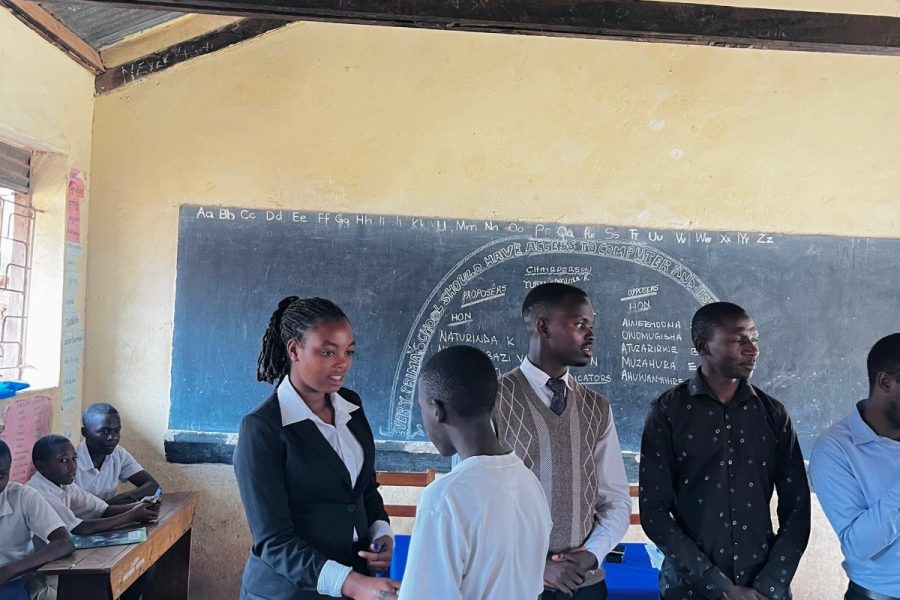 A PPG mentor greeting a pupil during a School Mentorship Programme session